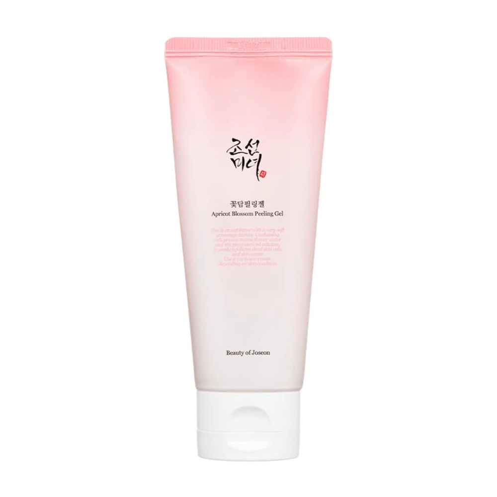 Un tubo rosa con Apricot Blossom Peeling Gel da Beauty of Joseon su uno sfondo bianco.