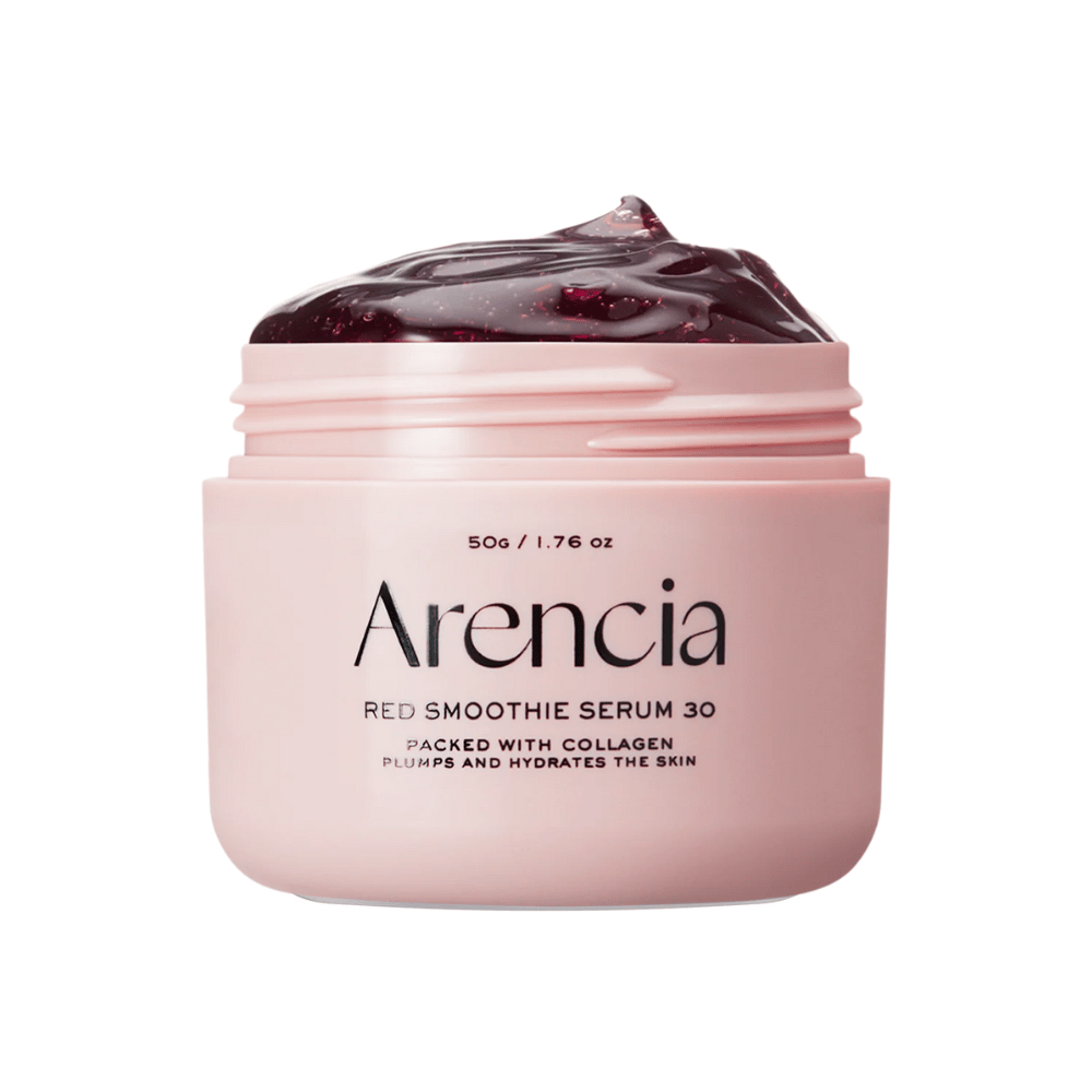 Primo piano su Arencia Red Smoothie Serum 30 in barattolo rosa, riempito con gel rosso profondo per idratazione e elasticità.
