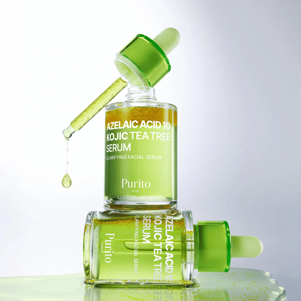 Purito Azelaic Acid 10 Kojic Tea Tree Serum – formula verde fresca con goccia dalla pipetta che mostra la leggera consistenza del siero.