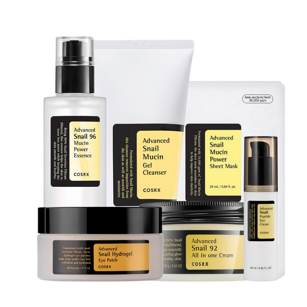 Una collezione di COSRX prodotti di bellezza a tema bava di lumaca, inclusi essenza, detergente in gel, maschera in fogli, patch per occhi e crema.