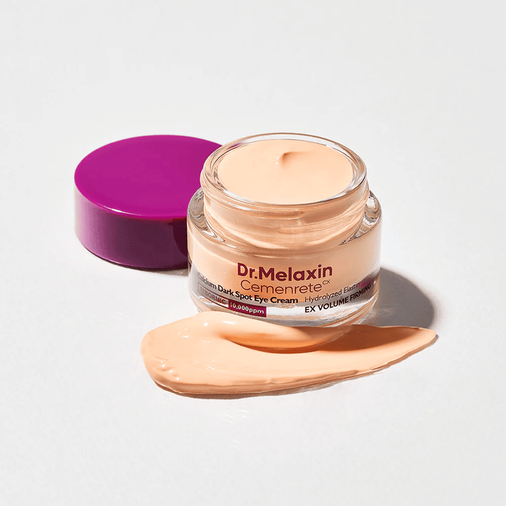 Dr.Melaxin Cemenrete Calcium Dark Spot Eye Cream in barattolo aperto con texture cremosa, contorno occhi  che aiuta a ridurre le occhiaie e rassodare la pelle intorno agli occhi.