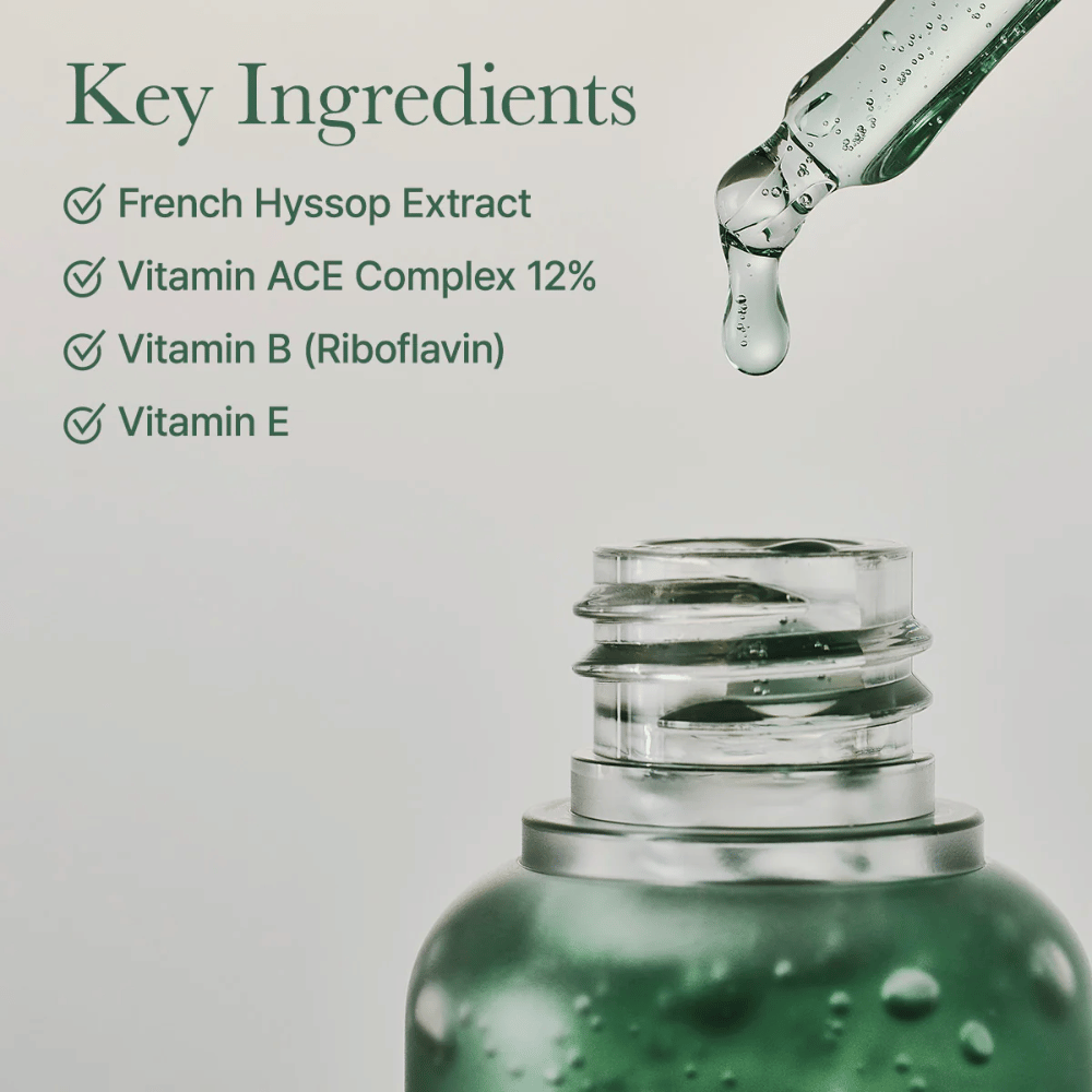Primo piano di flacone di siero con pipetta e testo sugli ingredienti chiave come estratto di issopo, complesso vitaminico ACE e vitamina E.