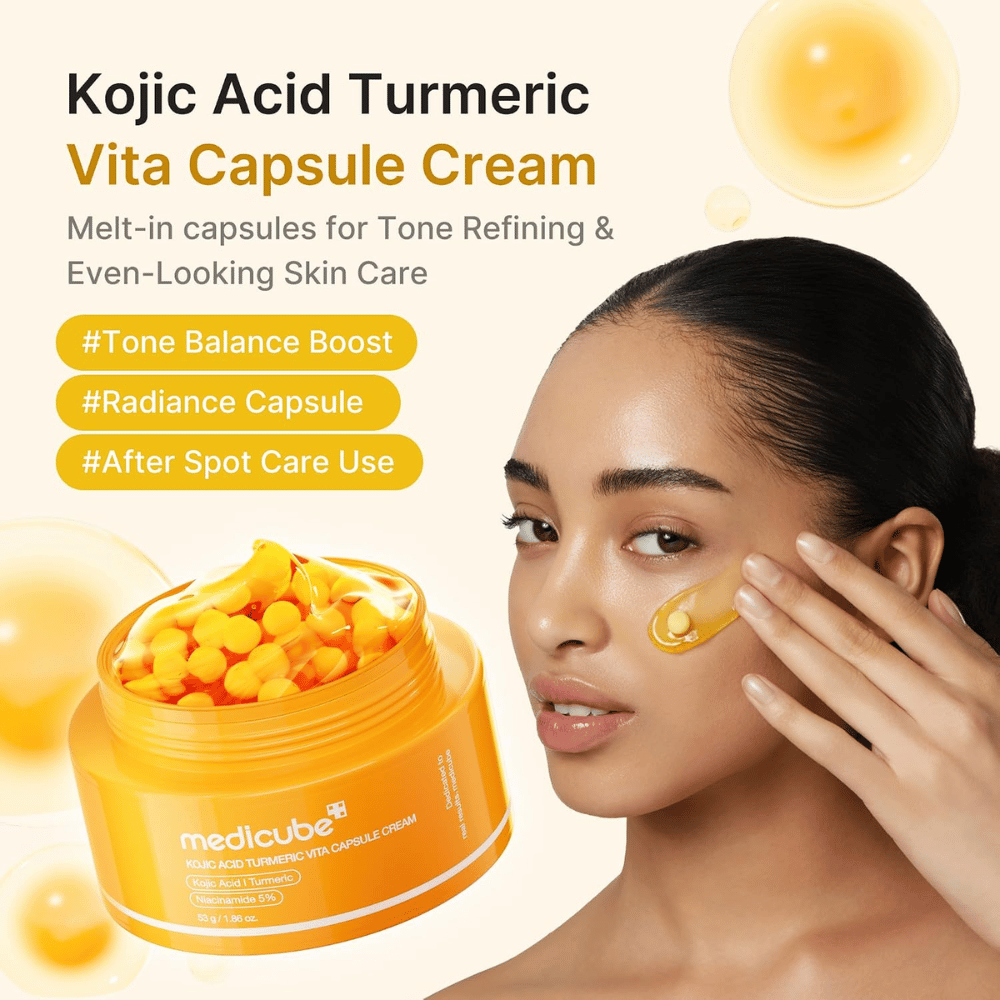 4. Medicube Kojic Acid Turmeric Vita Capsule Cream – crema viso illuminante con capsule applicata sulla guancia