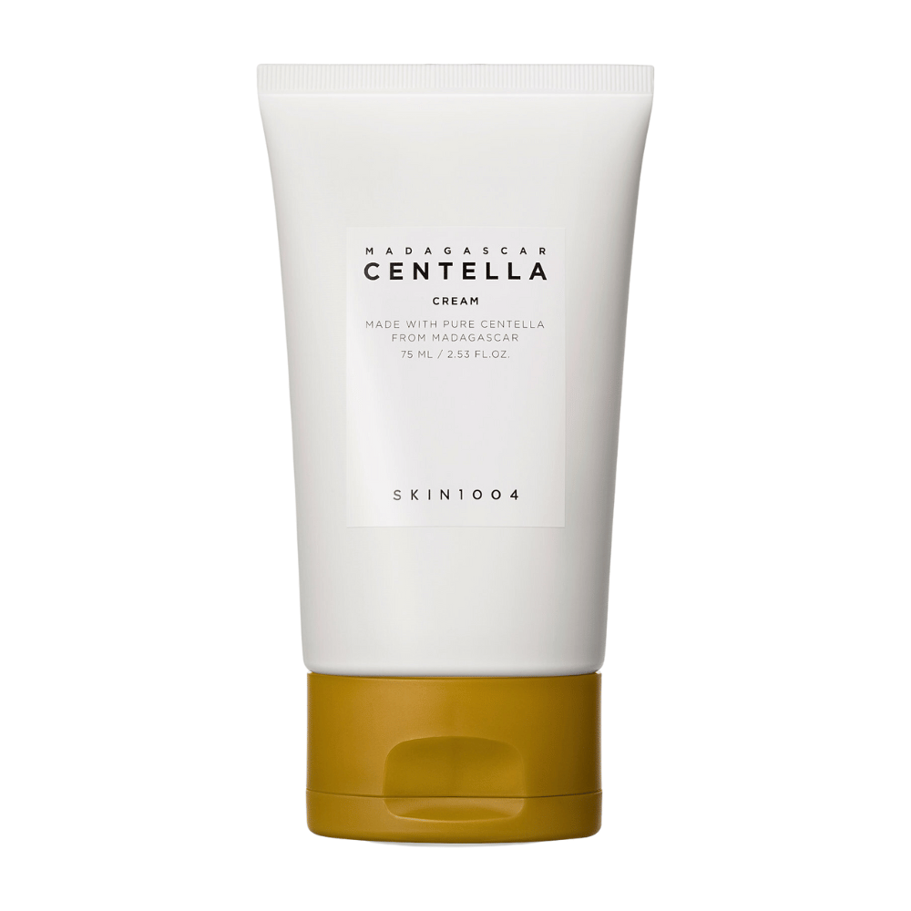 L'immagine mostra un tubo di "Madagascar Centella Cream" da SKIN1004. È una crema per la pelle realizzata con pura Centella del Madagascar e viene fornita in una confezione da 75 ml / 2.53 fl.oz. Il prodotto è destinato alla cura della pelle, per fornire nutrimento e idratazione alla pelle.