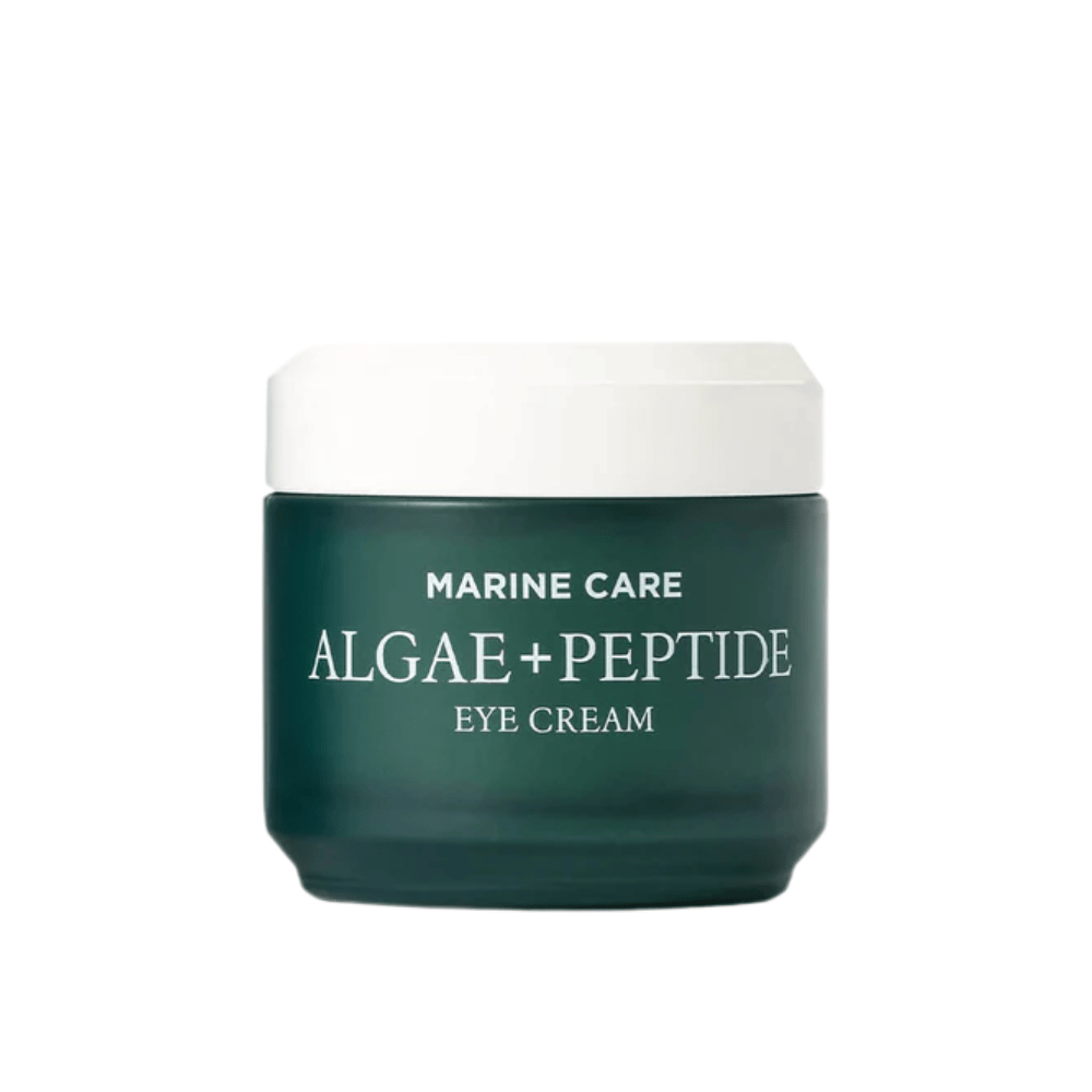 Heimish Marine Care Algae + Peptide Eye Cream in un barattolo verde scuro con coperchio bianco. Un crema contorno occhi arricchito con alghe e peptidi per idratare, illuminare e ridurre le linee sottili intorno agli occhi.