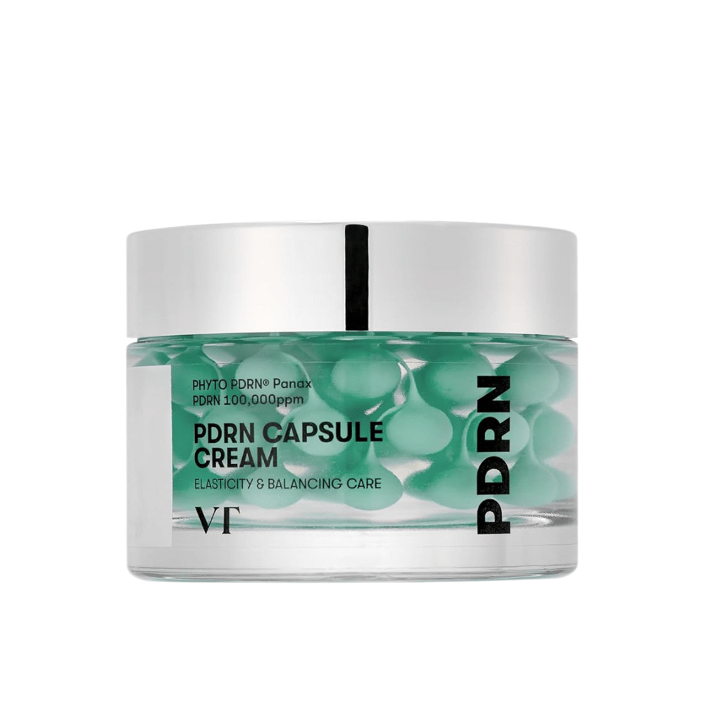 VT PDRN Capsule Cream in un barattolo trasparente con coperchio argentato. Il contenuto è composto da capsule verdi in un gel chiaro, e l'etichetta indica che la crema è destinata all'elasticità e alla cura equilibrante della pelle.