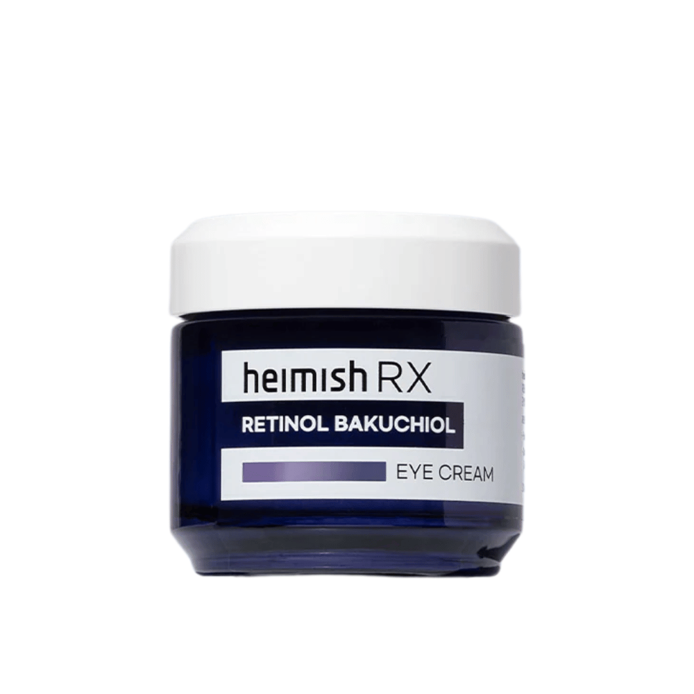 Heimish RX Retinol Bakuchiol Eye Cream in un barattolo blu scuro con coperchio bianco. Un crema contorno occhi arricchito con retinolo e bakuchiol per una pelle più liscia e soda intorno agli occhi.