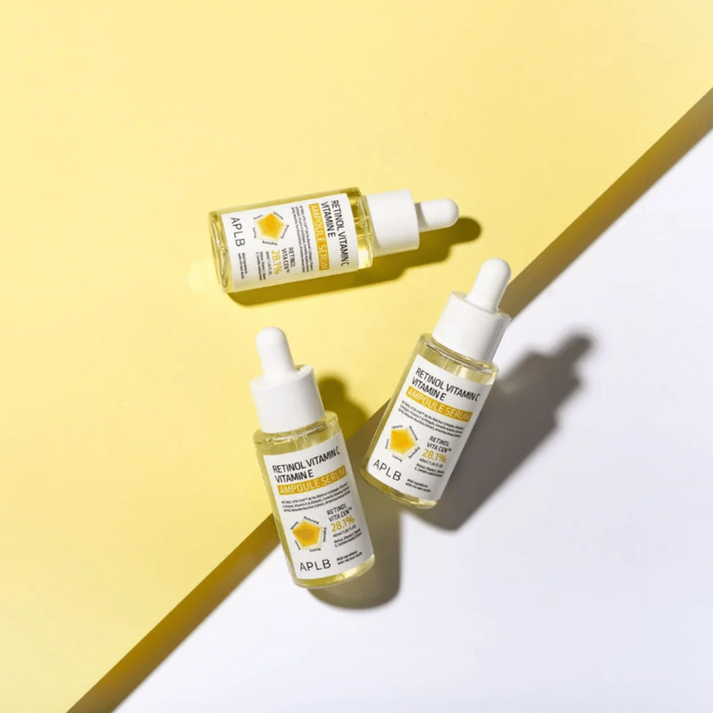 APLB Retinol Vitamin C Vitamin E Ampoule Serum su sfondo giallo e bianco