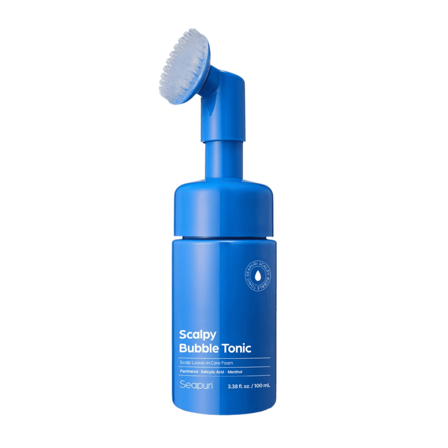 Immagine di prodotto scontornata di Seapuri Scalpy Bubble Tonic che mostra la bottiglia blu con spazzola in silicone integrata per un'applicazione facile e igienica direttamente sul cuoio capelluto.