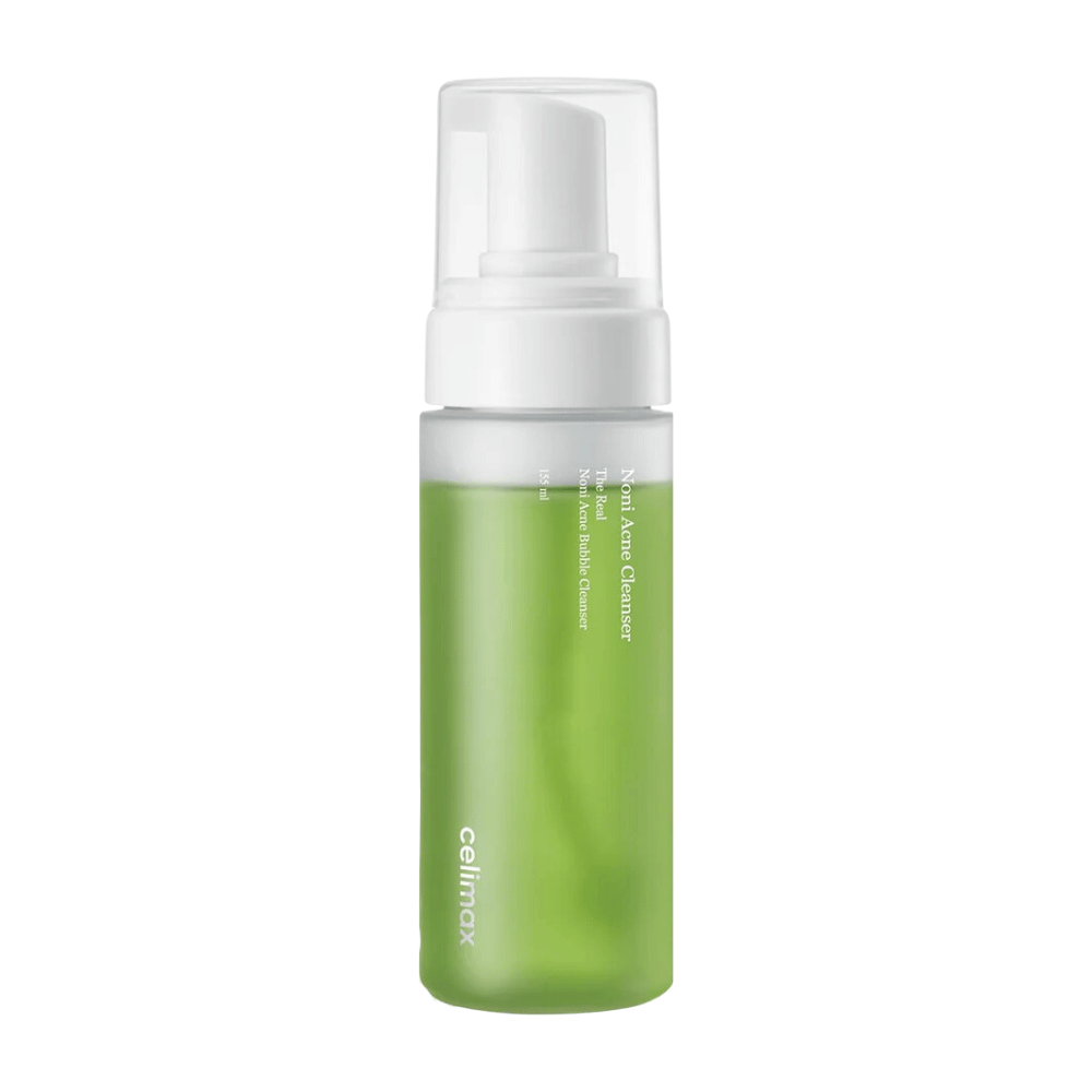 La bottiglia con The Real Noni Acne Bubble Cleanser mostra un tono fresco e verde, il che indica ingredienti naturali. Il dispenser a pompa la rende facile da usare e perfetta per creare un detergente ricco e schiumoso. Ideale per combattere l'acne e dare alla pelle una sensazione chiara e pulita.