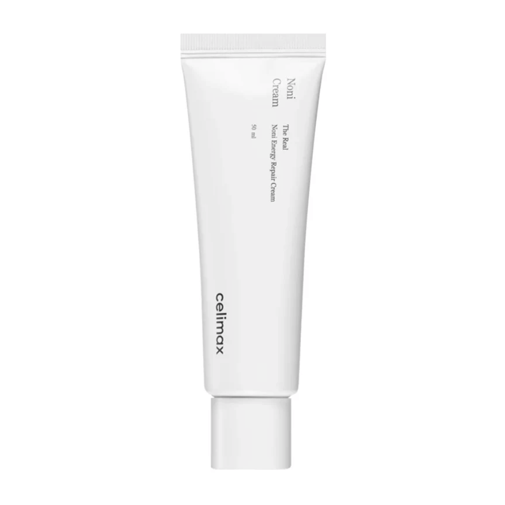 Celimax Noni Energy Repair Cream in un tubo bianco con testo nero. Il prodotto è contrassegnato come "The Real Noni Energy Repair Cream" e ha un volume di 50 ml.