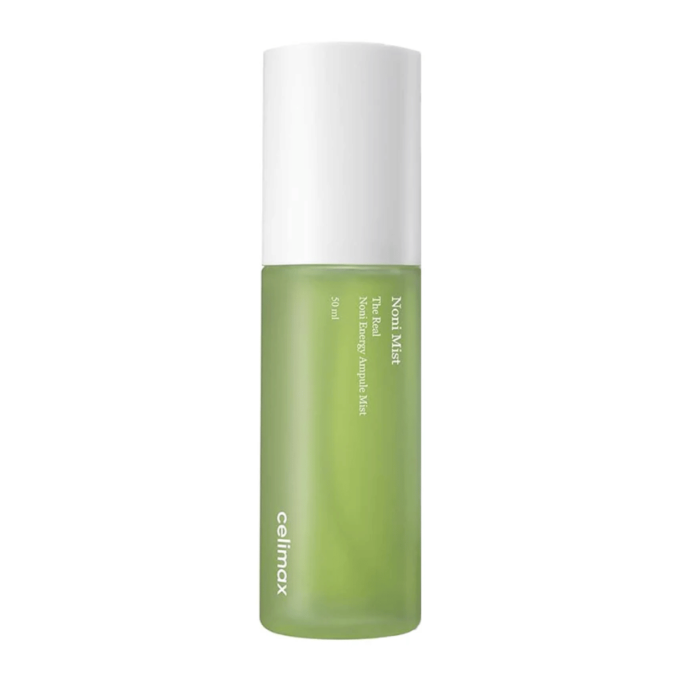 Celimax Noni Mist in una bottiglia verde con tappo bianco. Il prodotto, "The Real Noni Energy Ampule Mist," ha una capacità di 50 ml ed è commercializzato per dare energia e idratazione alla pelle.