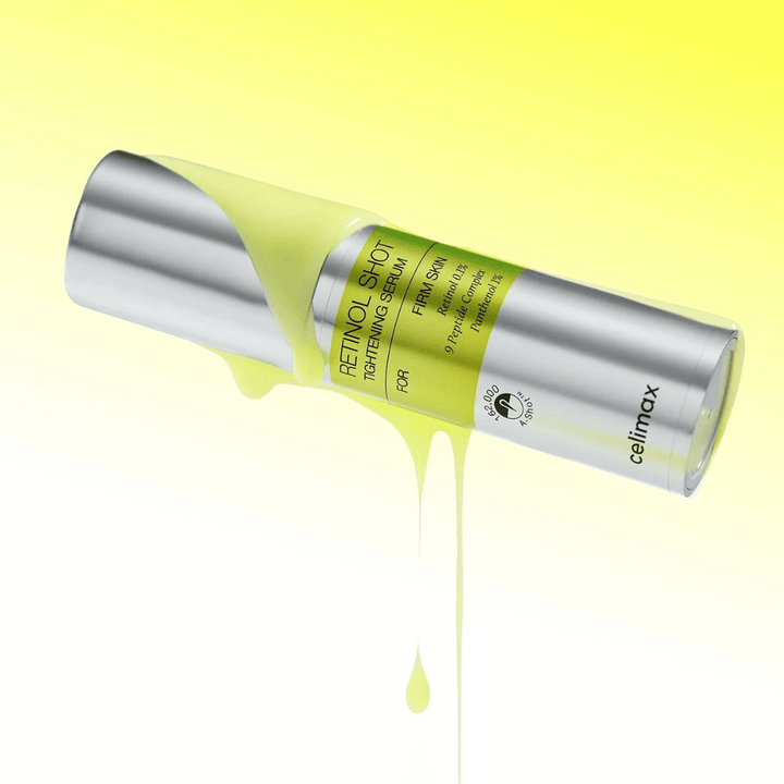 Produktbild av The Vita-A Retinol Shot Tightening Serum från Celimax med gult serum rinnande längs flaskan mot en ljusgul bakgrund.