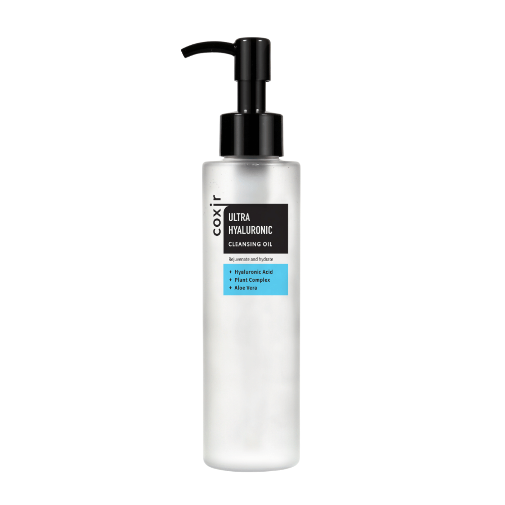 Un flacone dosatore bianco con il testo "coxir ULTRA HYALURONIC CLEANSING OIL", contenente acido ialuronico, complesso vegetale e aloe vera per idratazione e purificazione.